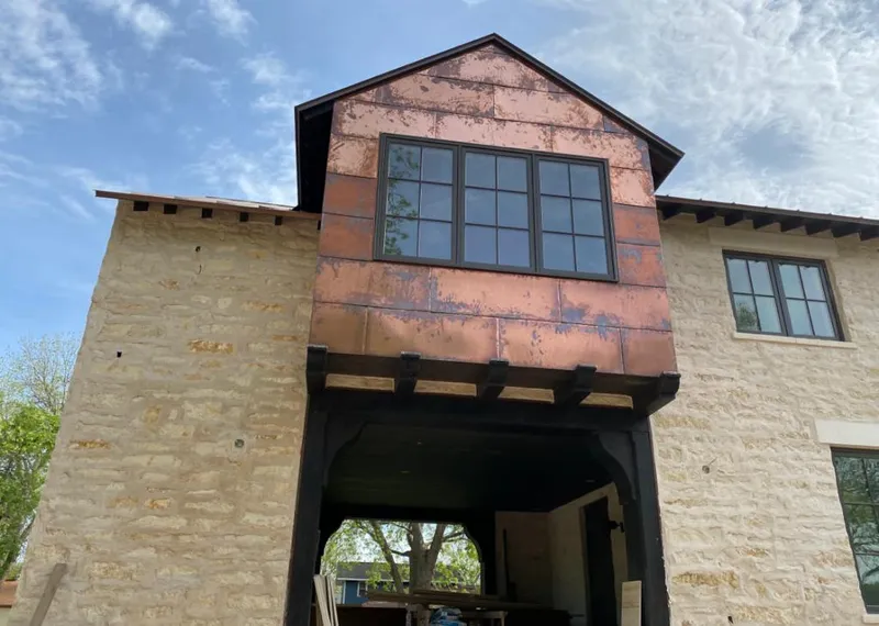 Copper metal panel facade on a stone building for Metal Roof Coating in Pittsburg